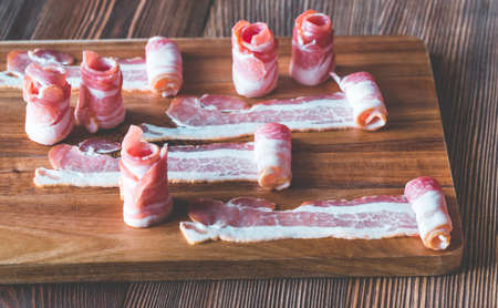 Bacon strips on the wooden board