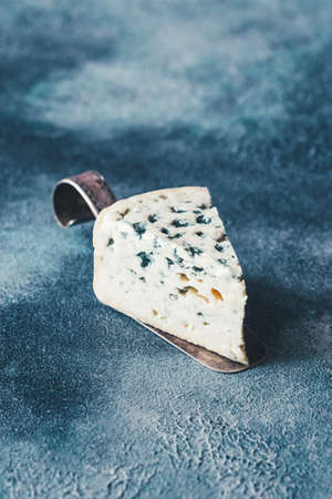 A wedge of blue cheeseの写真素材