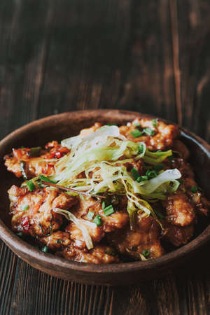 Asian chicken in a sweet and sour sauceの写真素材