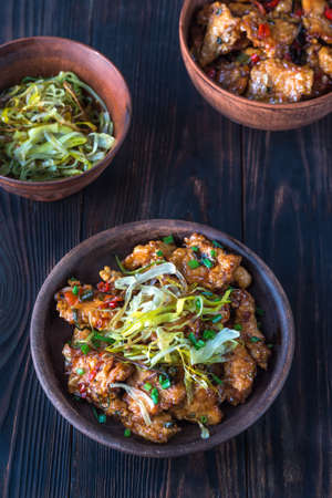 Asian chicken in a sweet and sour sauceの写真素材