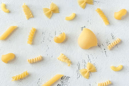 Various types of pasta on the white background