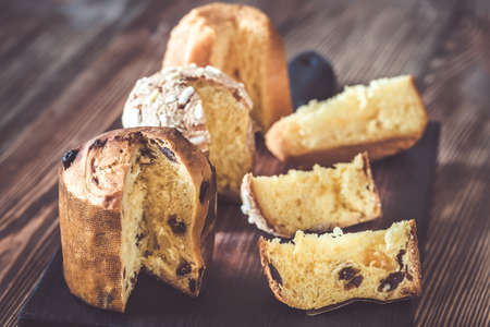 Italian Christmas cakes collection on a wooden boardの写真素材