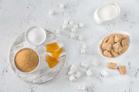 Different kinds of sugar on the woodenの写真素材