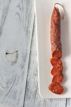 Spanish chorizo sausage on the white background