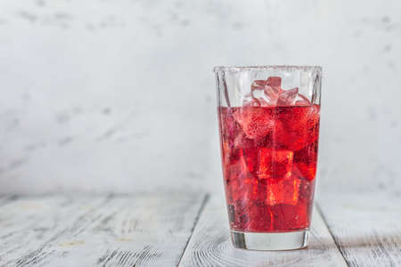 Glass of cherry mojito on the wooden backgroundの写真素材