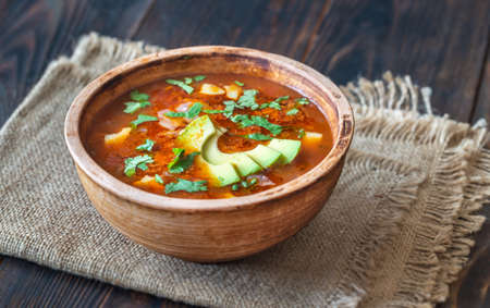 Bowl of spicy Mexican soup on the rustic backgroundの写真素材