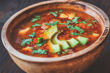 Bowl of spicy Mexican soup on the rustic backgroundの写真素材