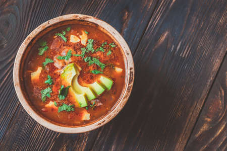 Bowl of spicy Mexican soup on the rustic backgroundの写真素材