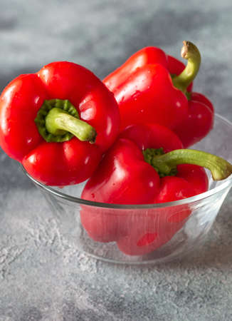 Fresh red peppers in the glass bowl