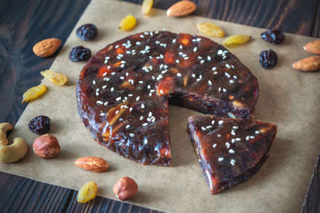 Pressed fruit and nut cake on the woodenの写真素材
