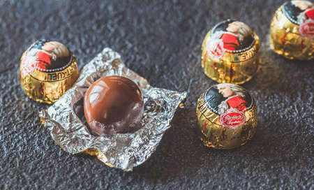 SUMY, UKRAINE - SEPTEMBER 1, 2019:  Mozartkugel - famous Austrian marzipan chocolate candiesの写真素材