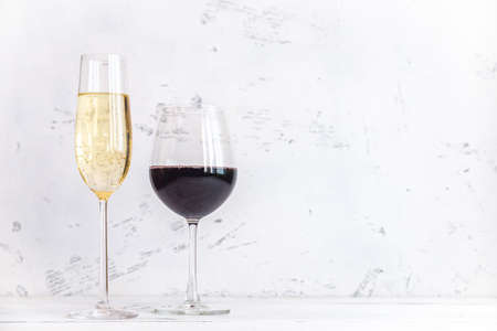 Glasses of wine and sparkling wine on whiteの写真素材