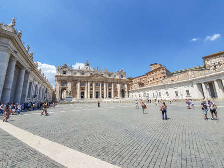 VATICAN CITY, VATICAN - JULY 14: St. Peter's Basilica and St. Peter's Square on July 14,2019. St. Peter's Square is a plaza located in front of St. Peter's Basilica.のeditorial素材