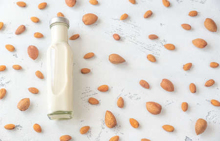 Glass bottle of almond milk: top viewの写真素材