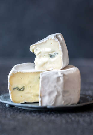 Soft cheese with white and blue mold: cross section