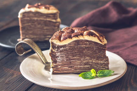 Slice of tiramisu crepe cake on the plate