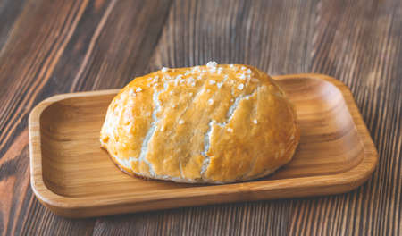 Whole beef Wellington on the wooden plate