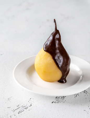 Poire belle Helene -  French dessert made from poached pear served with chocolate syrupの写真素材