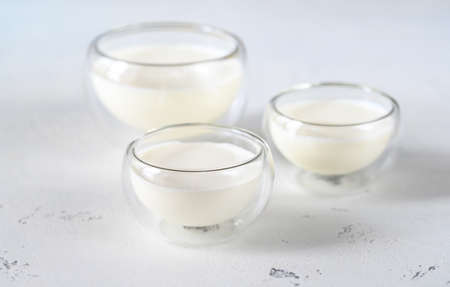 Glass bowls of different dairy productsの写真素材