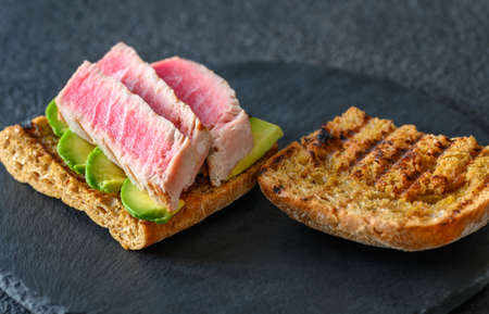 Sandwich with tuna and avocado close-upの写真素材