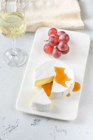 Camembert with glass of white wine