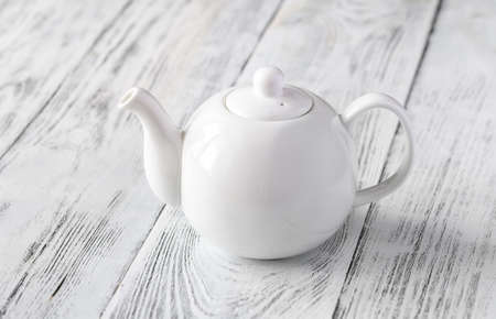 Porcelain teapot with tea close-upの写真素材