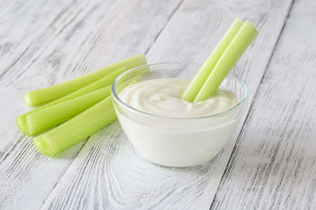 Leaf celery stalk dipped in Greek yogurtの写真素材
