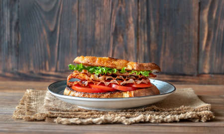 Sandwich with bacon, lettuce and tomatoes