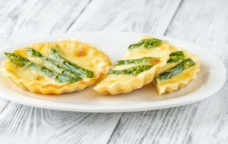 Mini mozzarella asparagus tarts close upの写真素材