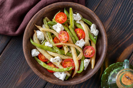 Spicy salad with green and yellow beans, tomatoes and feta cheeseの写真素材