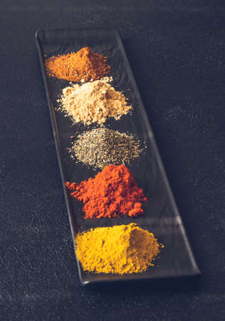 Different kinds of spices on black backgroundの写真素材