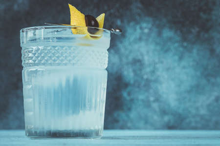 Glass of Casino cocktail garnished with a lemon zest and a maraschino cherryの写真素材
