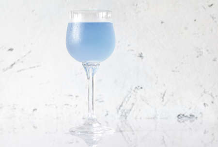 Glass of Aviation cocktail on white backgroundの写真素材