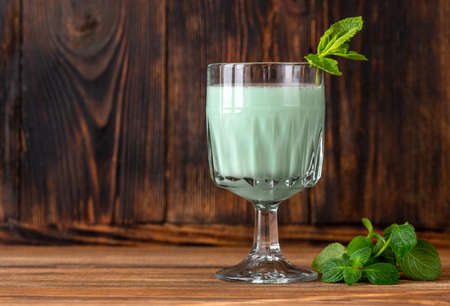 Glass of Grasshopper Cocktail garnished with mint and grated chocolateの写真素材