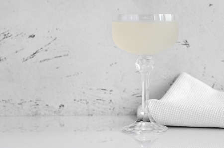 A glass of White Lady Cocktail on white backgroundの写真素材