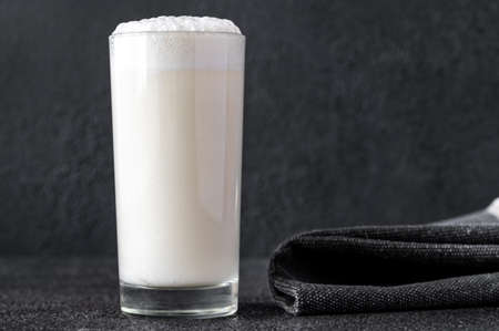 Glass of Ramos Gin Fizz Cocktail on dark backgroundの写真素材