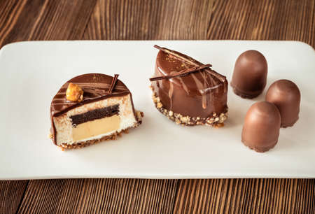 Decorated chocolate cake on the white plateの写真素材