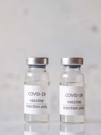 Two tubes of COVID-19 coronavirus vaccineの写真素材