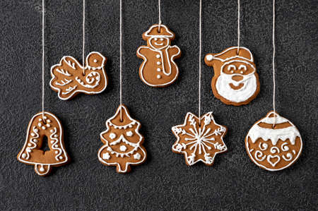 Christmas tree decoration gingerbread cookies on black background