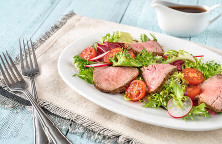 Roast beef salad on the serving plateの写真素材