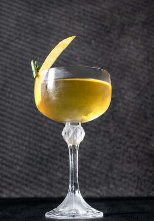 Glass of Alaska cocktail on the dark backgroundの写真素材