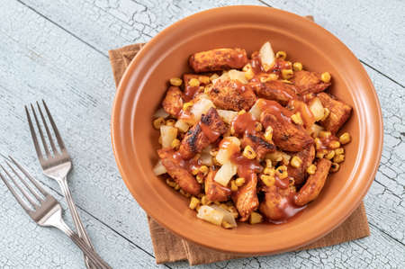 Portion of chicken pineapple salad with grilled cornの写真素材