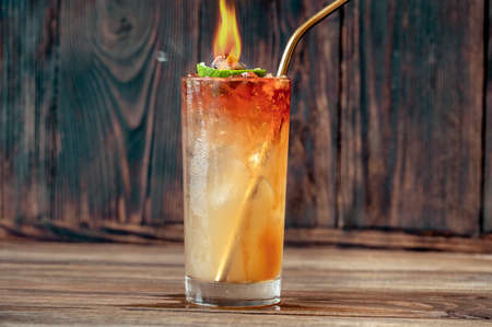 Glass of Holy water cocktail on the wooden backgroundの写真素材