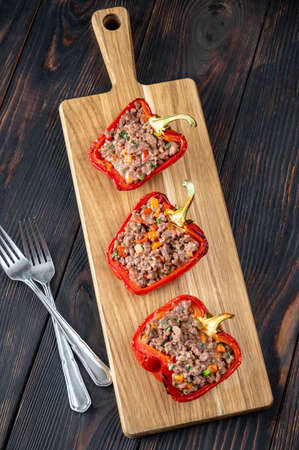 Stuffed peppers with mince meat on the woooden boardの写真素材