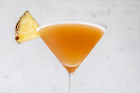 Glass of Bahamas Daiquiri garnished with pineapple wedgeの写真素材