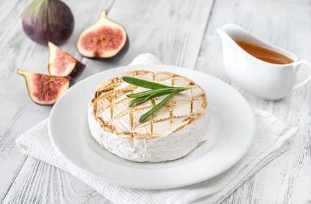 Grilled Camembert with fresh figs and honeyの写真素材