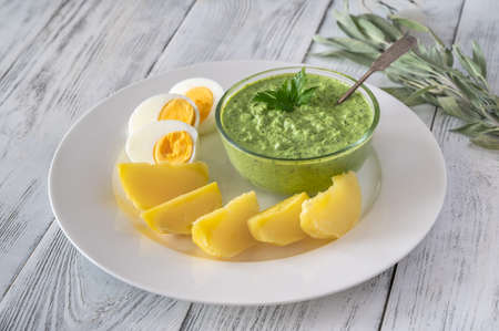 Frankfurt's Green Sauce garnished with boiled potatoes and eggsの写真素材