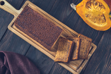 Loaf of pumpkin bread on the wooden boardの写真素材
