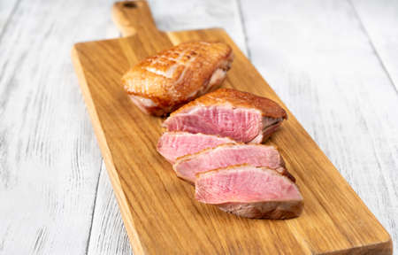 Crispy fried duck breast on the cuttung boardの写真素材