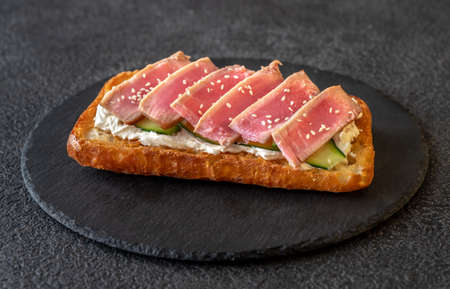 Sandwich with cream cheese, tuna and sesame seeds